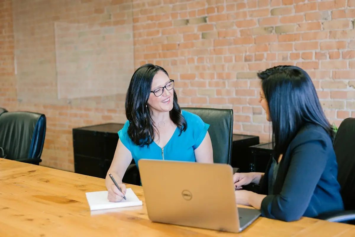 Researcher analyzing dating profile photos on multiple screens