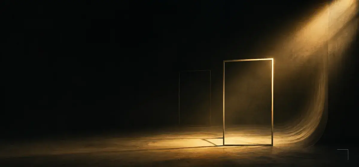 A single warm gold key light raking across an empty dark studio backdrop, representing AI professional headshots