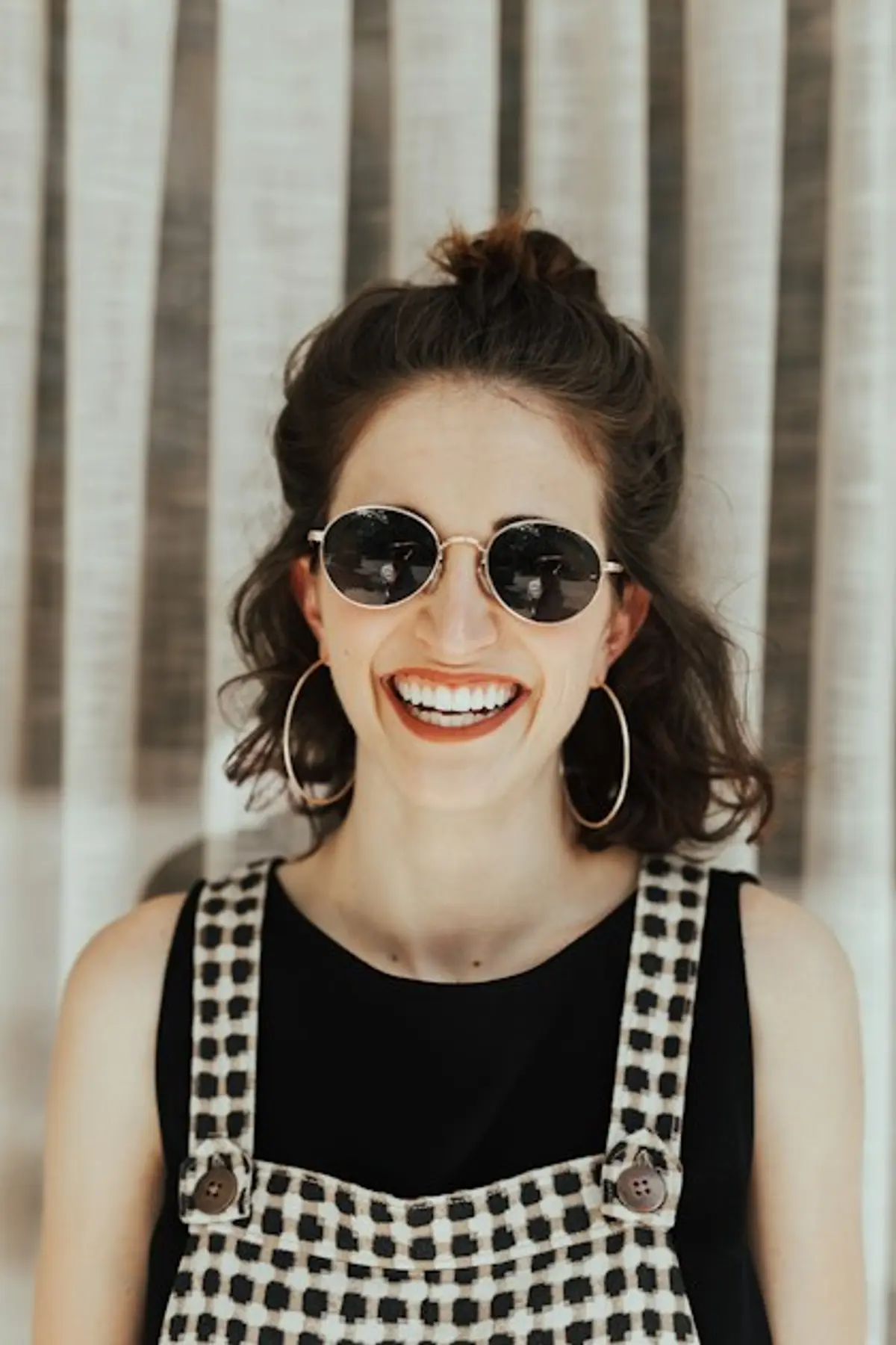 Close-up of person making direct eye contact with camera, representing connection in dating photos