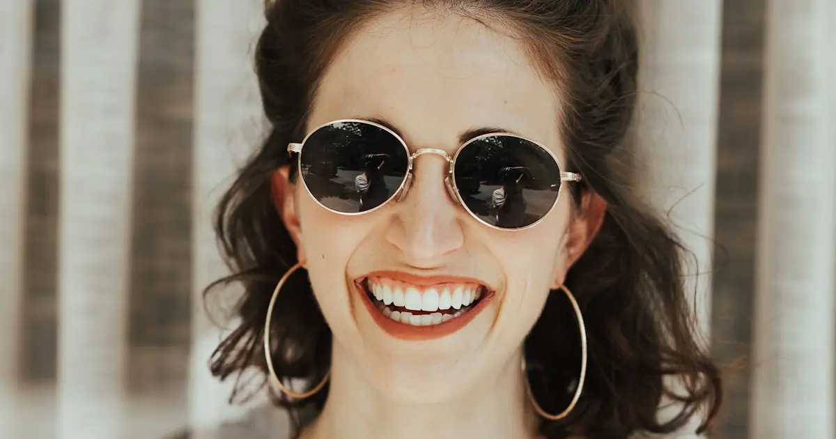 Close-up of person making direct eye contact with camera, representing connection in dating photos