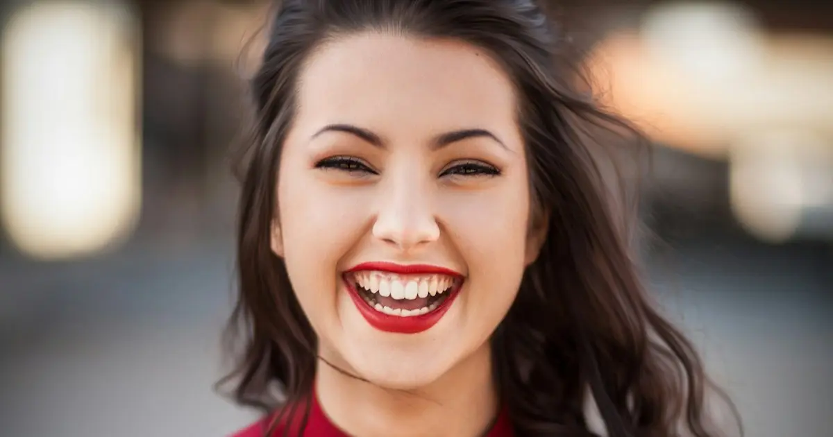 Woman taking a dating profile photo for Bumble